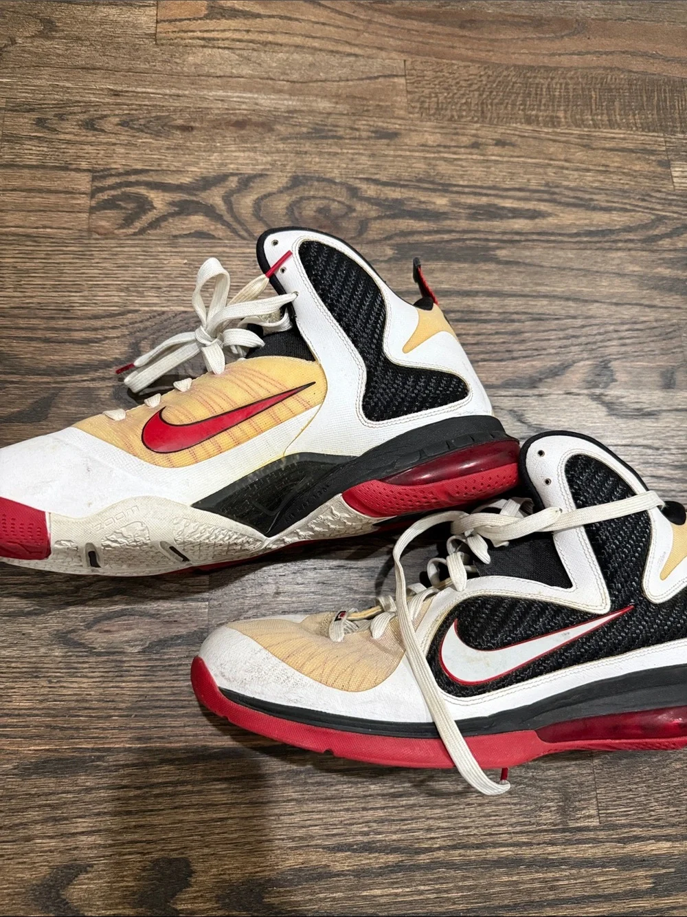 Nike men’s Black, White, Red & Gold High-Top Sneakers